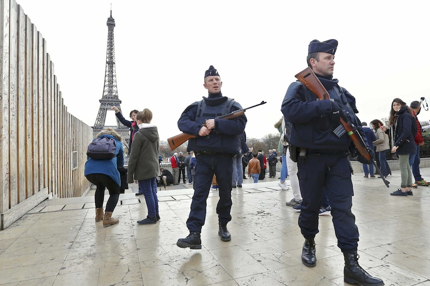 Police patrol near the Eiffel Tower