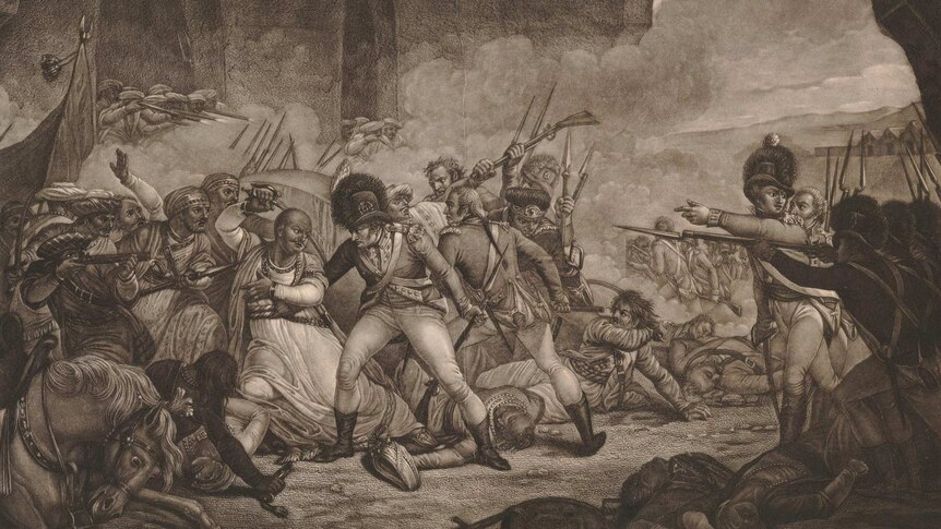 A violent and chaotic hand to hand fight between Indian and British soldiers. Tipu Sultan raises a sword.