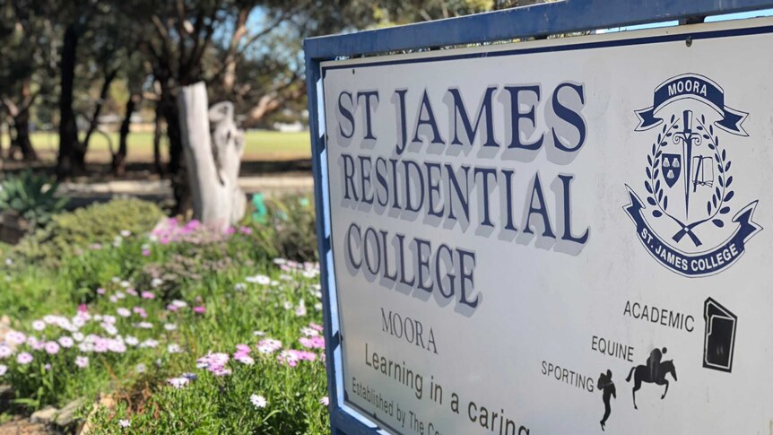 A sign next to flowers out the front of Moora Residential College.