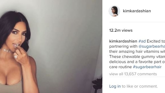 Kim Kardashian instagram post of her promoting a sugar bear hair product