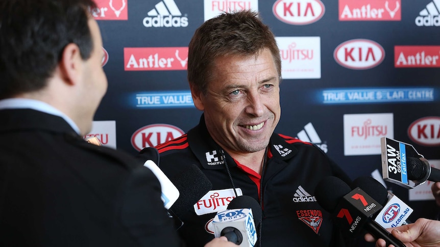 Mark Thompson speaks to the media at Essendon training