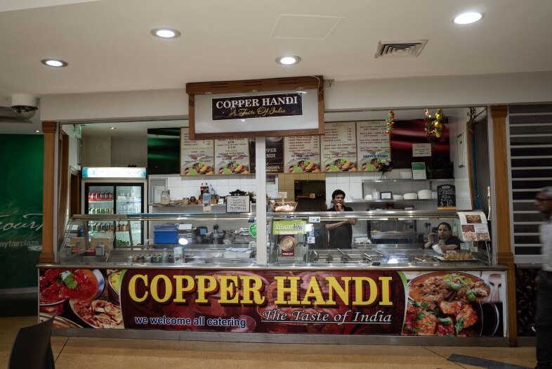 An empty Indian outlet at a food court.