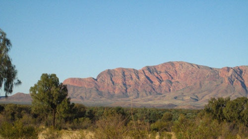 The remote community of Haasts Bluff - hill by main road