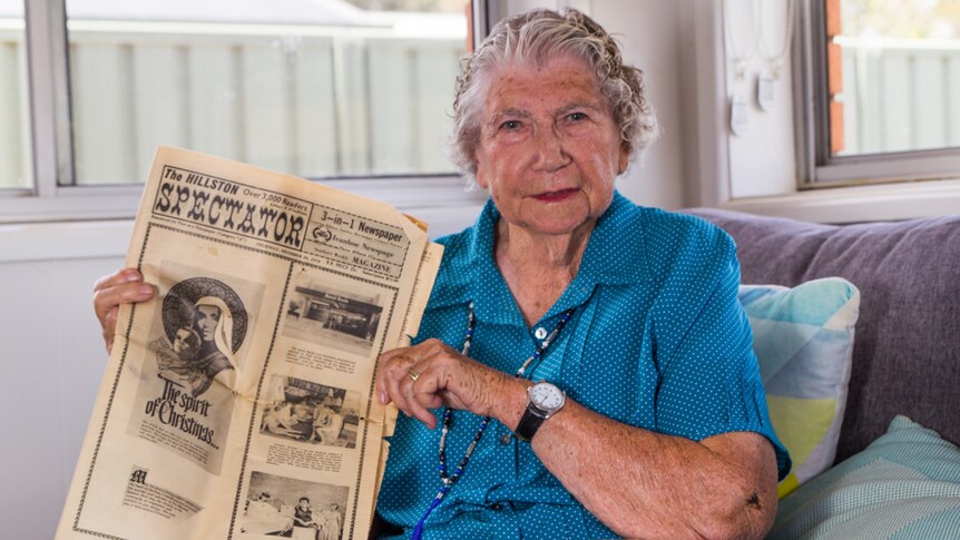 Elderly Orange resident Thelma Witchurch holding a copy of newspaper. the Ivanhoe Spectator