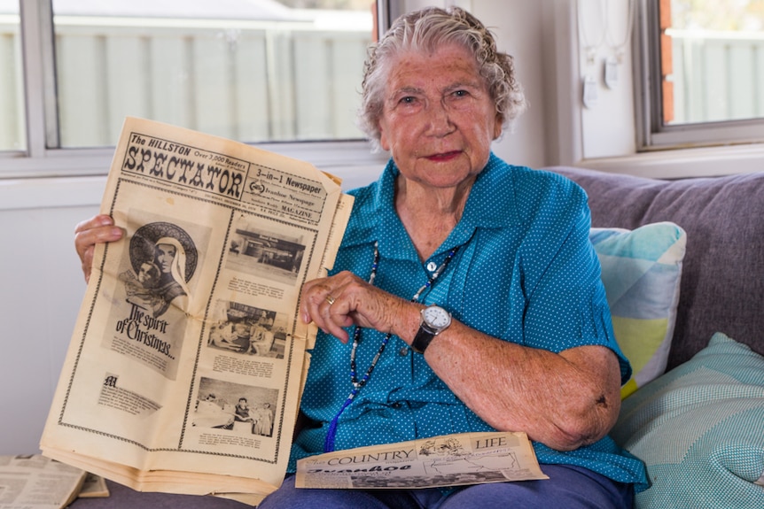 Elderly Orange resident Thelma Witchurch holding a copy of newspaper. the Ivanhoe Spectator