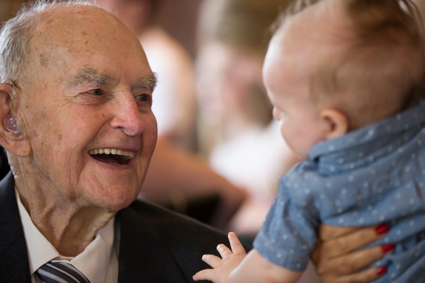 George Barlin with his great-grandchild.