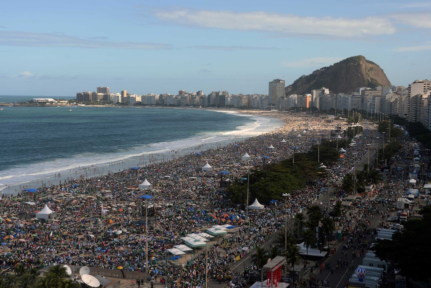 Crowds gather at Copacabana beach ahead of Pope vigil