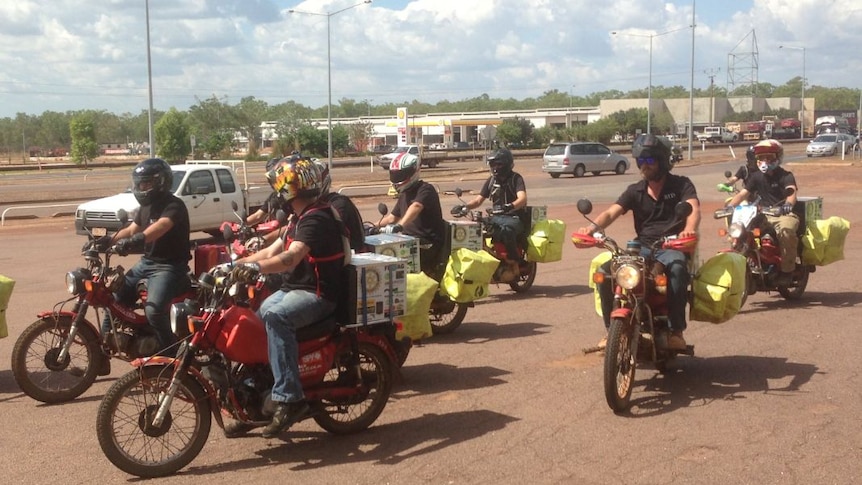 A group of men arrive in Darwin on July 25 on postie bikes after riding from Strathalbyn to raise awareness of depression and money for Beyond Blue