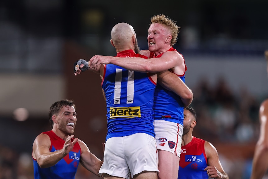 Clayton Oliver celebrating a goal with Max Gawn
