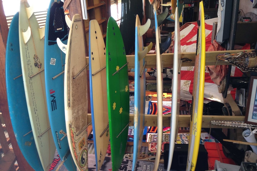 Surf boards in shed.