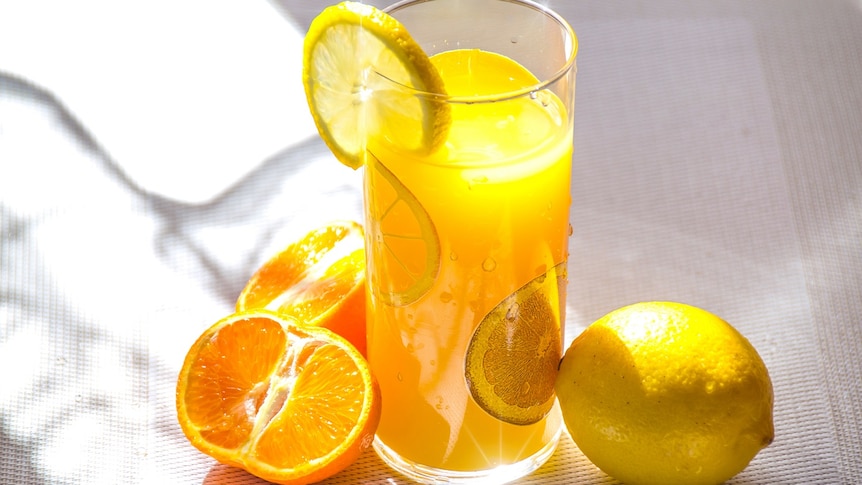 Glass of a citrus drink for story about how to know if you're getting enough vitamin c