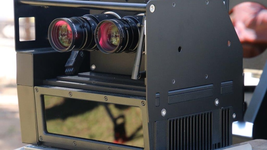 Close up of a rear facing speed camera being put in WA police cars.