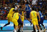 Australia's Daniel Kickert is punched by a jumping Jason William