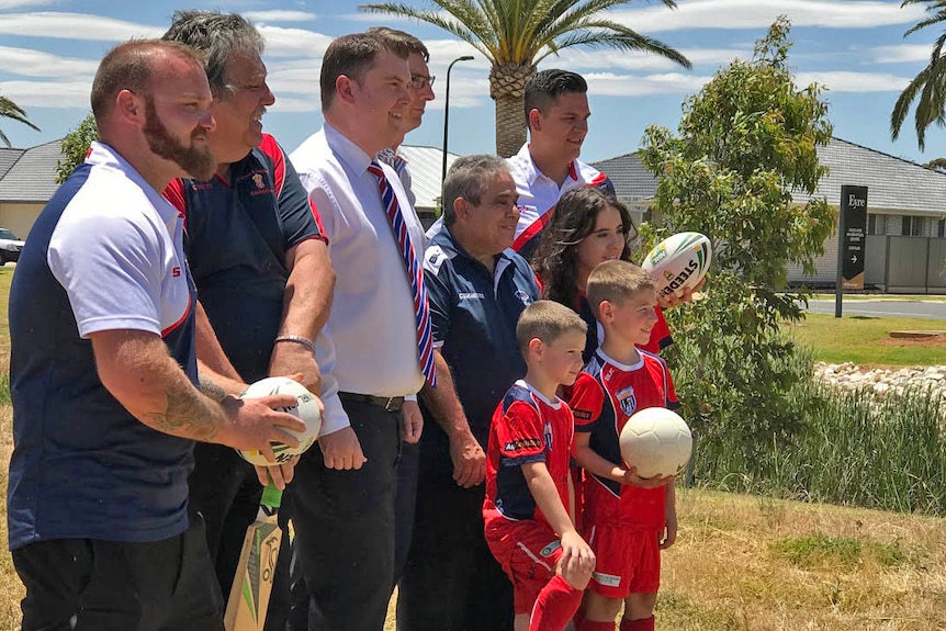 Adam Levy and other locals pose for a photo