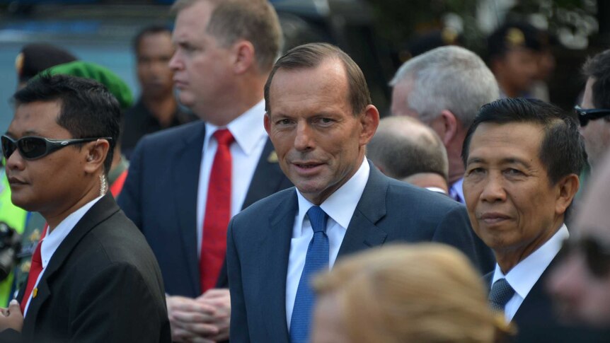 Australian Prime Minister Tony Abbott (C) visit Bali bombing monument in Kuta.