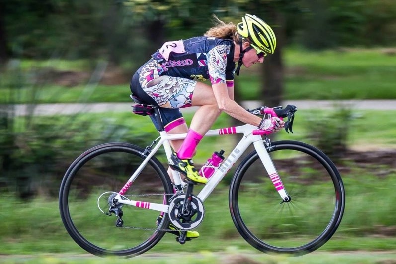 Cyclist Rachel Edwards on her bike, pictured in a story about budgeting for fitness