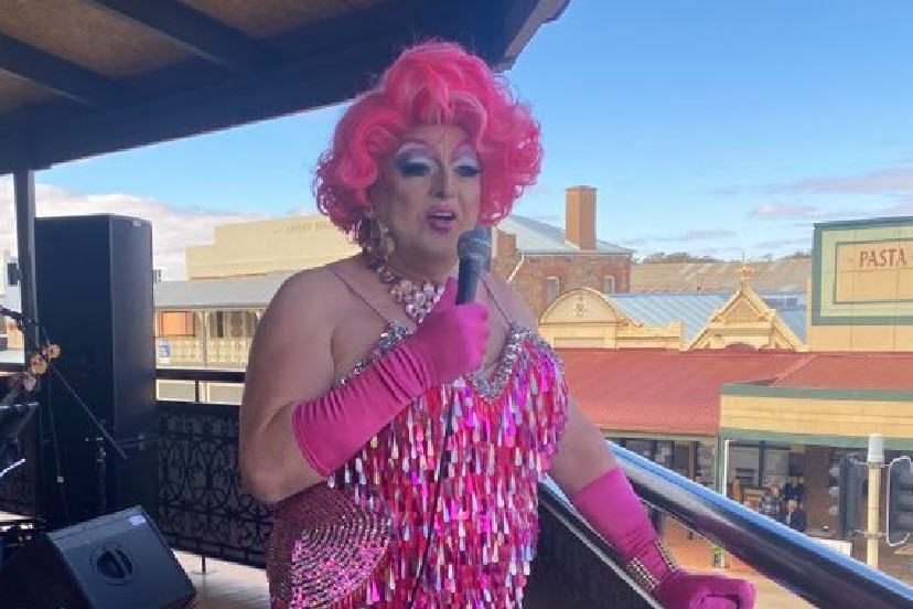 Broken Hill businessman Steve Radford dressed in drag and singing from a pub balcony.