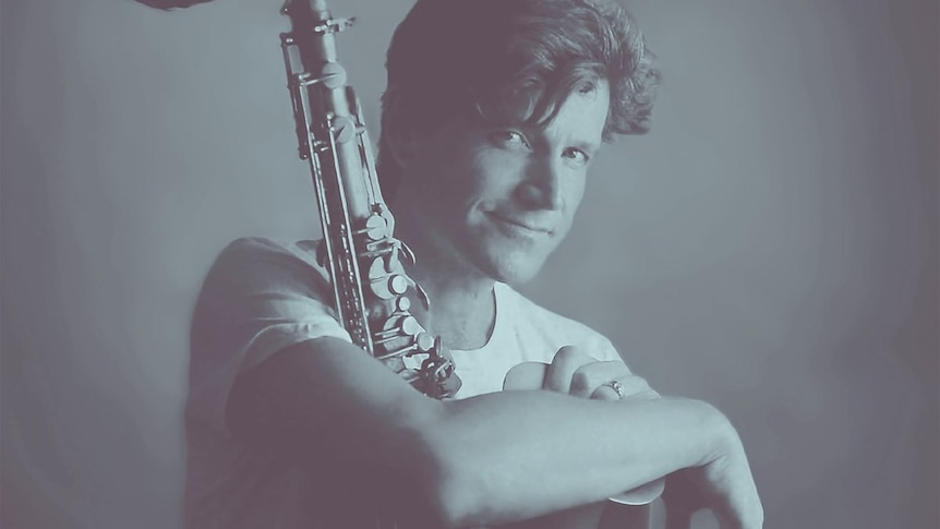 Jakob Dinesen sits with his saxophone