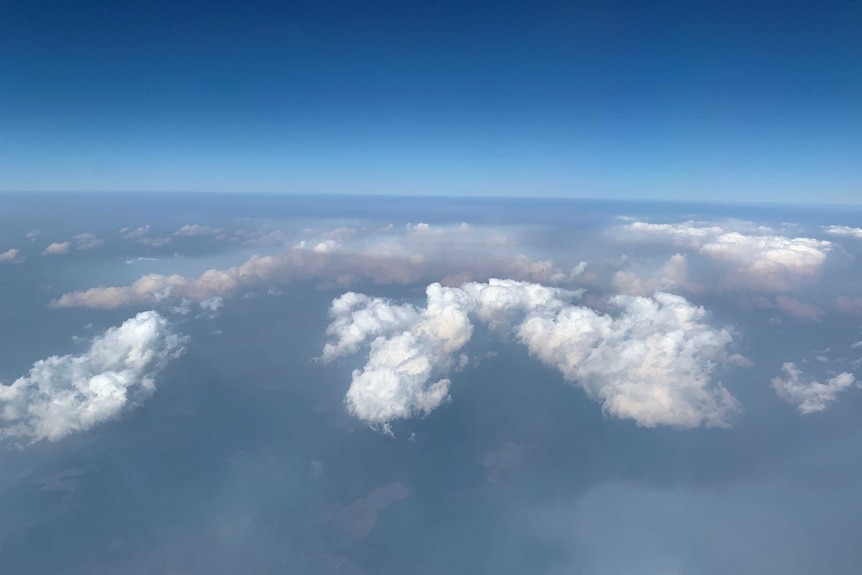 A photo from the plane shows haze over Brisbane.