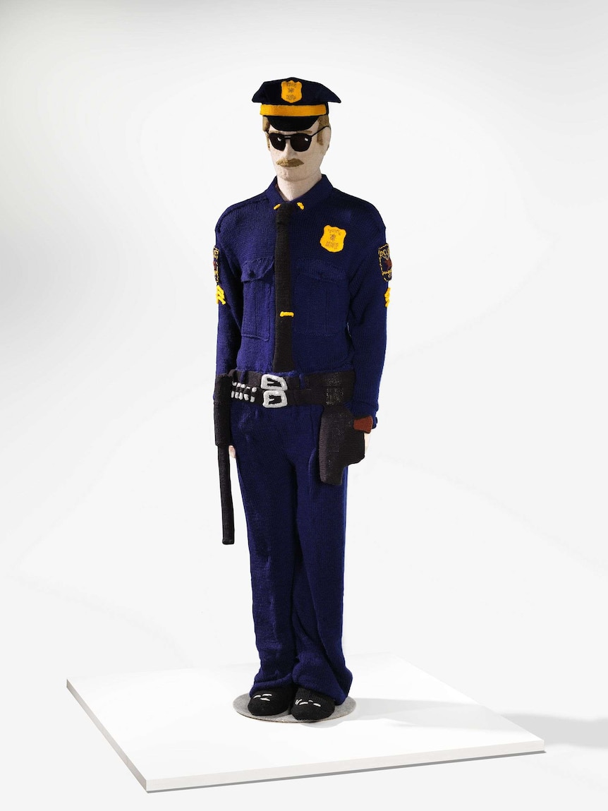 A knitted sculpture of a police officer by the artist Kate Just