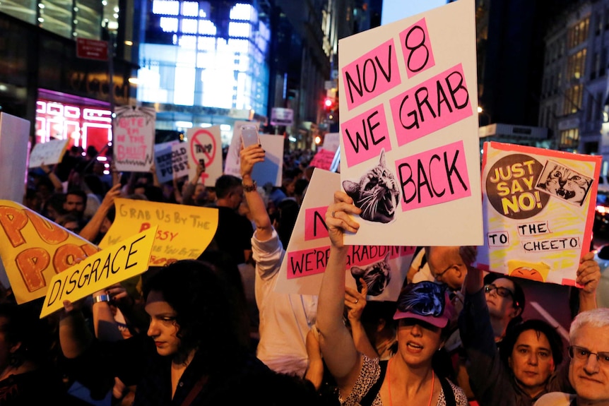 Women protest against Republican presidential nominee Donald Trump and the GOP in front of Trump Tower in Manhattan.