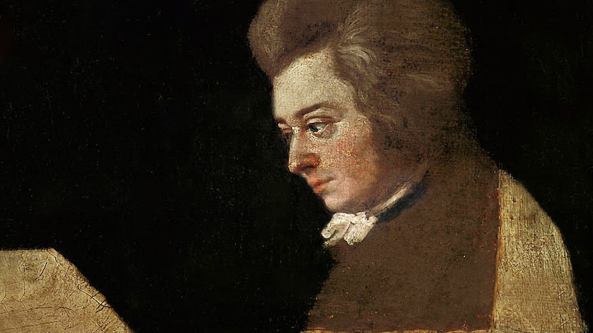 And unfinished painting of Mozart in profile on a black background.