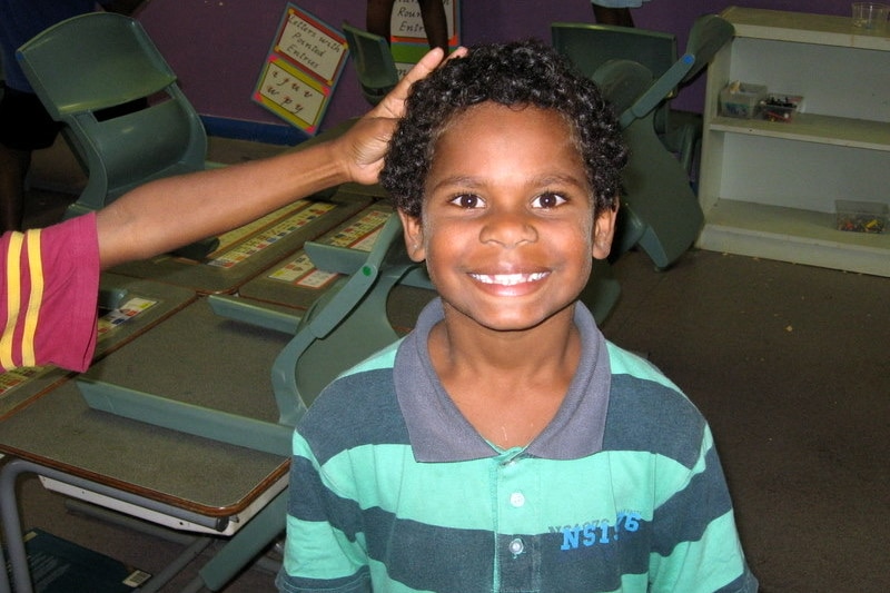 small boy in striped shirt