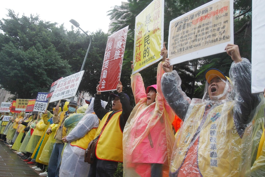 Taiwan protesters demand tax reform outside of Ministry of Finance in Taipei, Taiwan.