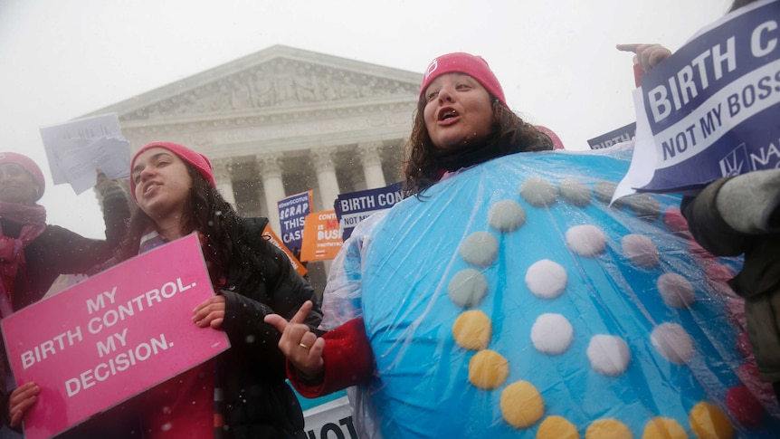 A protester wears a birth controls pills costume in front of the US Supreme Court.