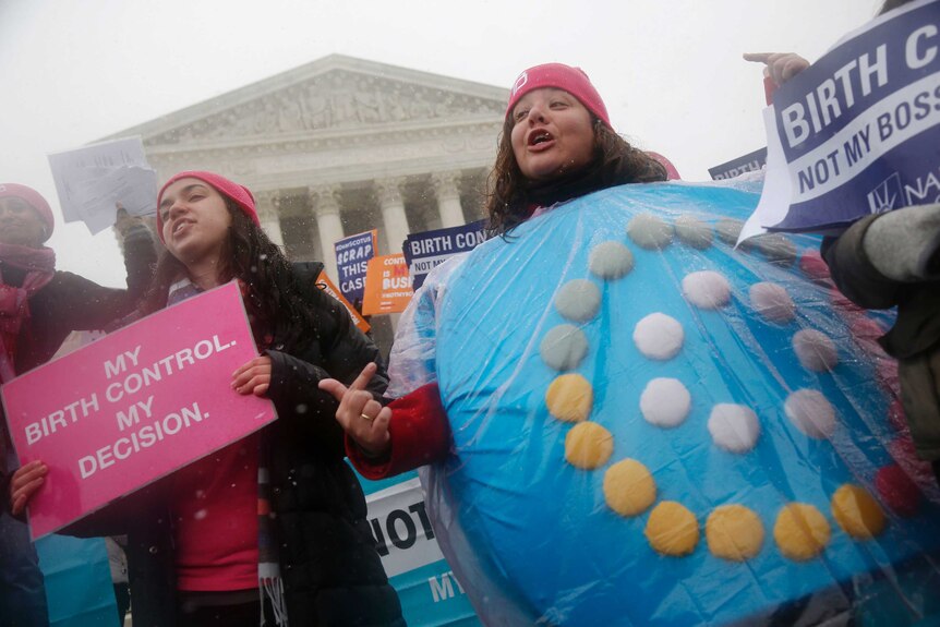 A protester wears a birth controls pills costume in front of the US Supreme Court.