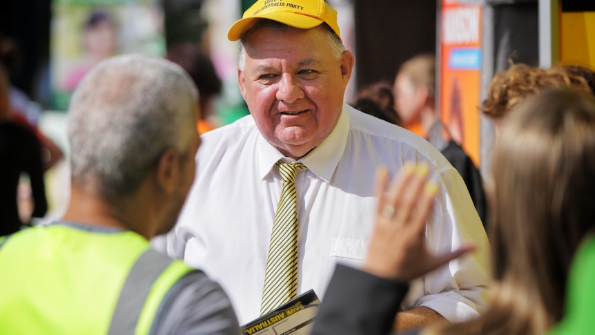 Craig Kelly in a yellow hat.