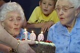 100 year old twins blow out candles