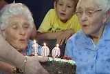 100 year old twins blow out candles