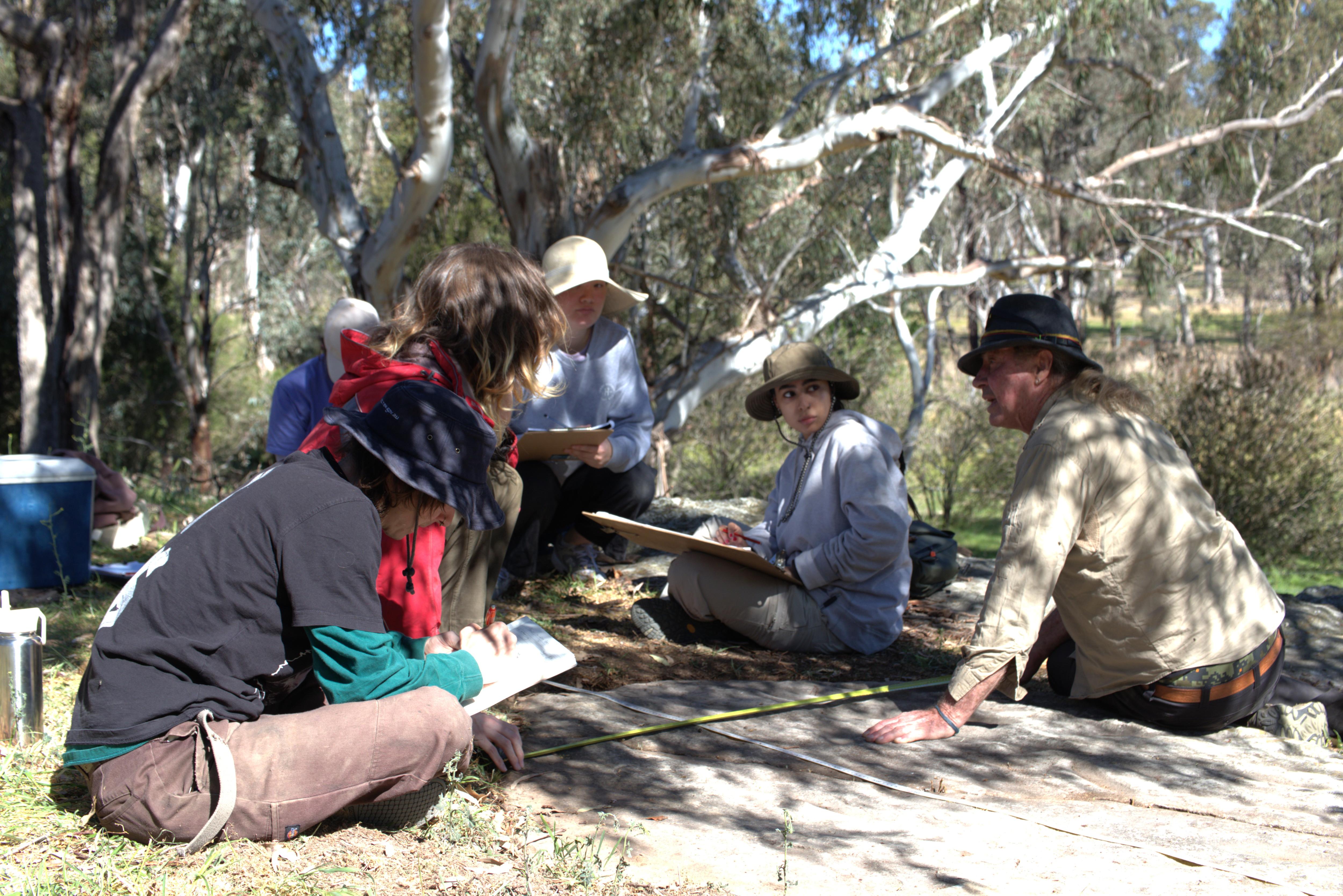 Archaeology students work beside traditional owners at ancient site