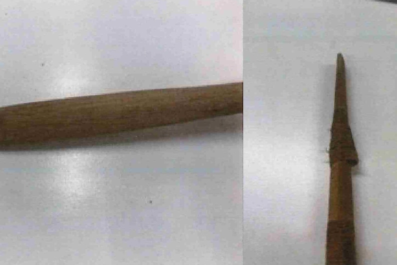 Two close-up images of a wooden spear on a white backdrop
