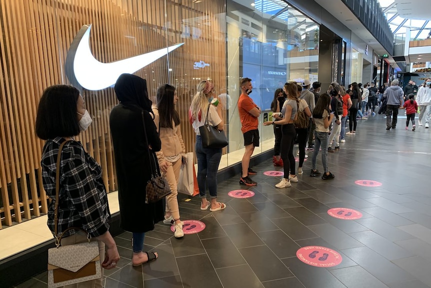 A queue of people outside a store inside Highpoint Shopping Centre.