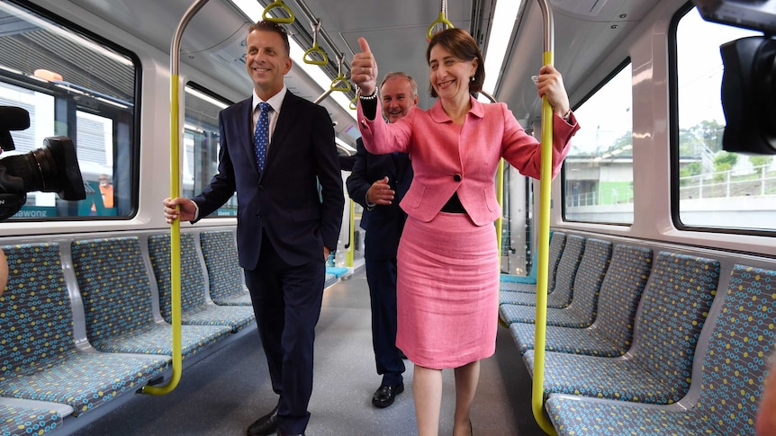 The Premier showing off the new trains with Transport Minister Andrew Constance