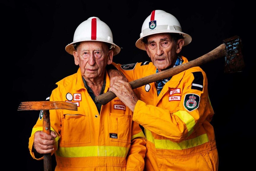 Bilpin Rural Fire Service members Albert Newtown and Bill Johnson stand in their fire gear.
