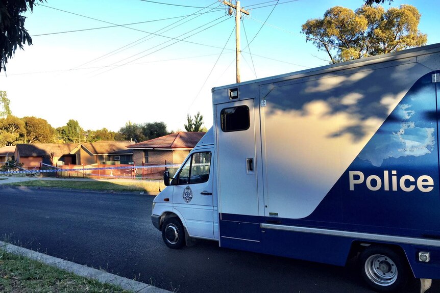Police at the scene of a fire at Long Gully