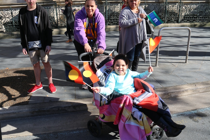 A family joins the NAIDOC march.