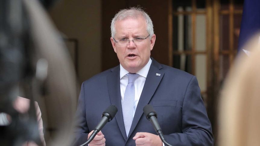 Prime Minister Scott Morrison speaking at a lectern in the Prime Minister's courtyard