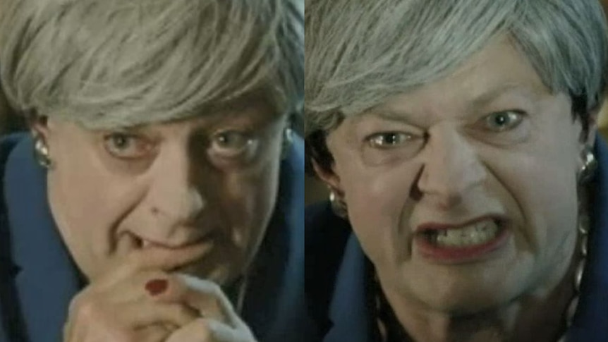 Andy Serkis, dressed as British prime minister Theresa May, in a grey wig and blue suit, sneering at the camera like Gollum.