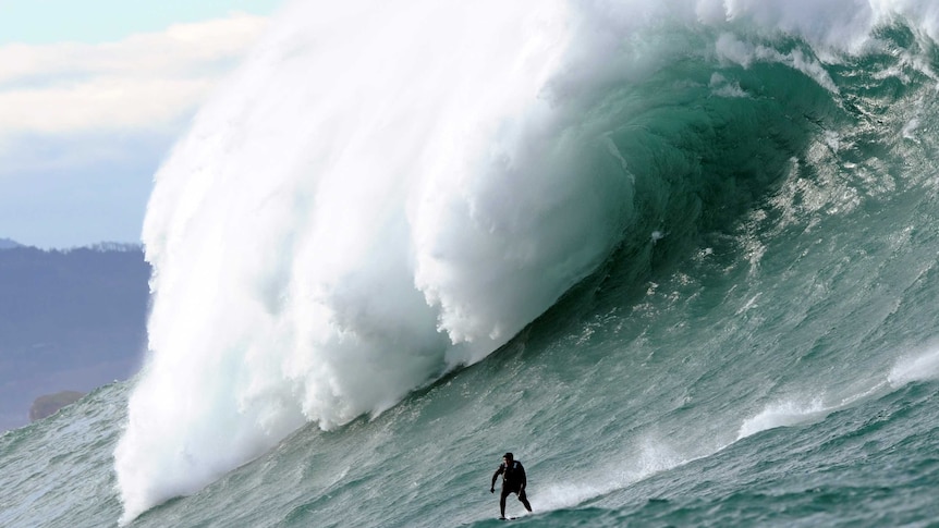 Surfers take on monster waves in France