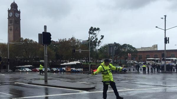 Police directing traffic on George Street near Sydney Central Station