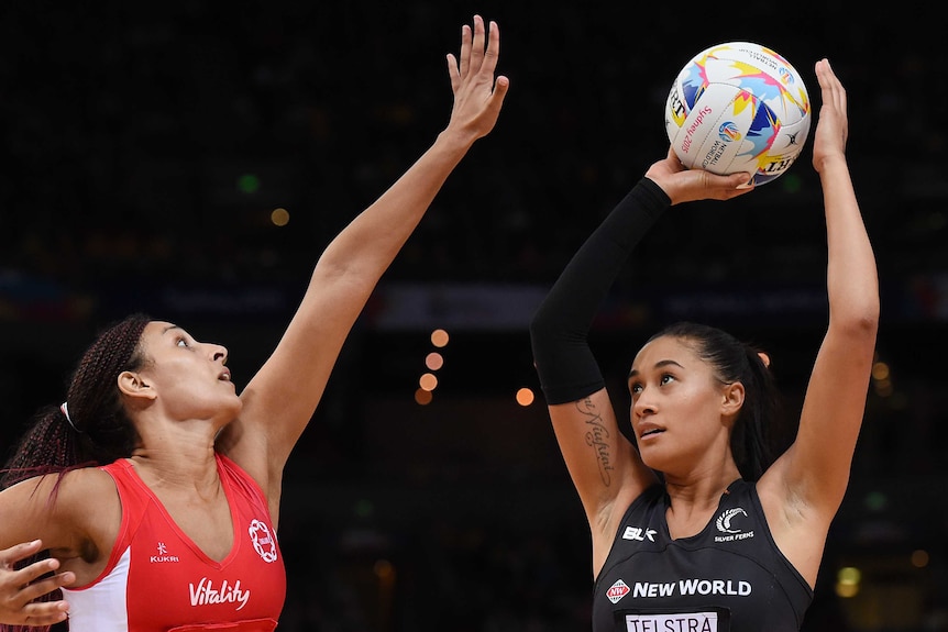England's Geva Mentor defends New Zealand's Maria Tutaia during the 2015 World Cup semi-final in Sydney.