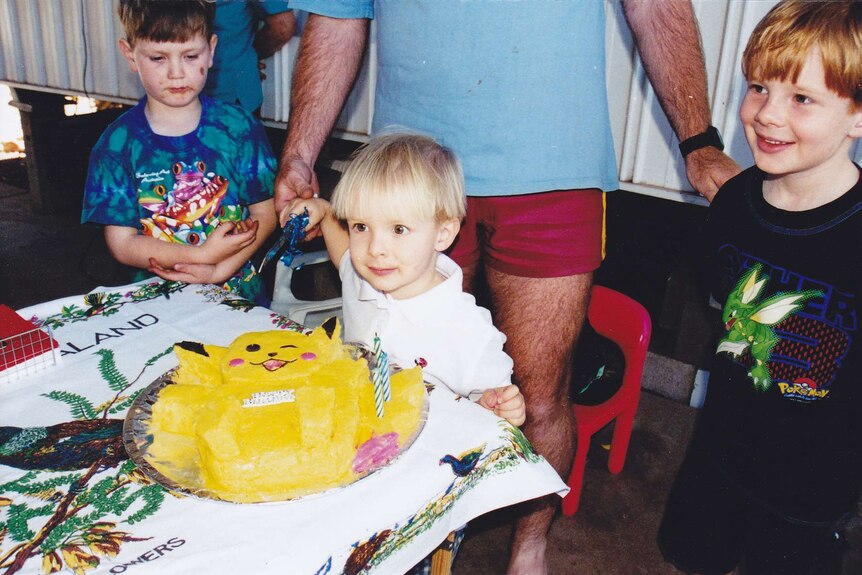 Harrison Creevey with a birthday cake on his third birthday.