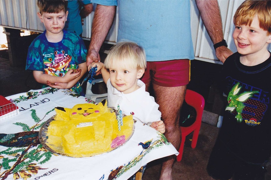 Harrison Creevey with a birthday cake on his third birthday.