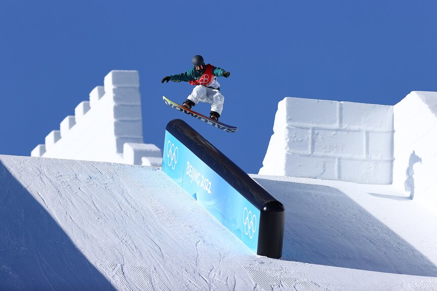 Tess Coady does a trick during her first run of the women's snowboard slopestyle final.