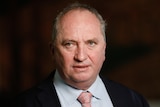 Barnaby Joyce looks serious as he stares at something out of frame.