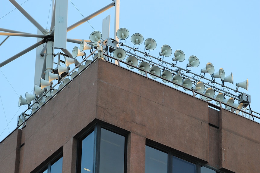 Speakers on building tops as part of Dark Mofo's show Siren Song, June 2017.